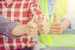 Business engineer man team giving thumb up as sign of Success Business Teamwork Concept