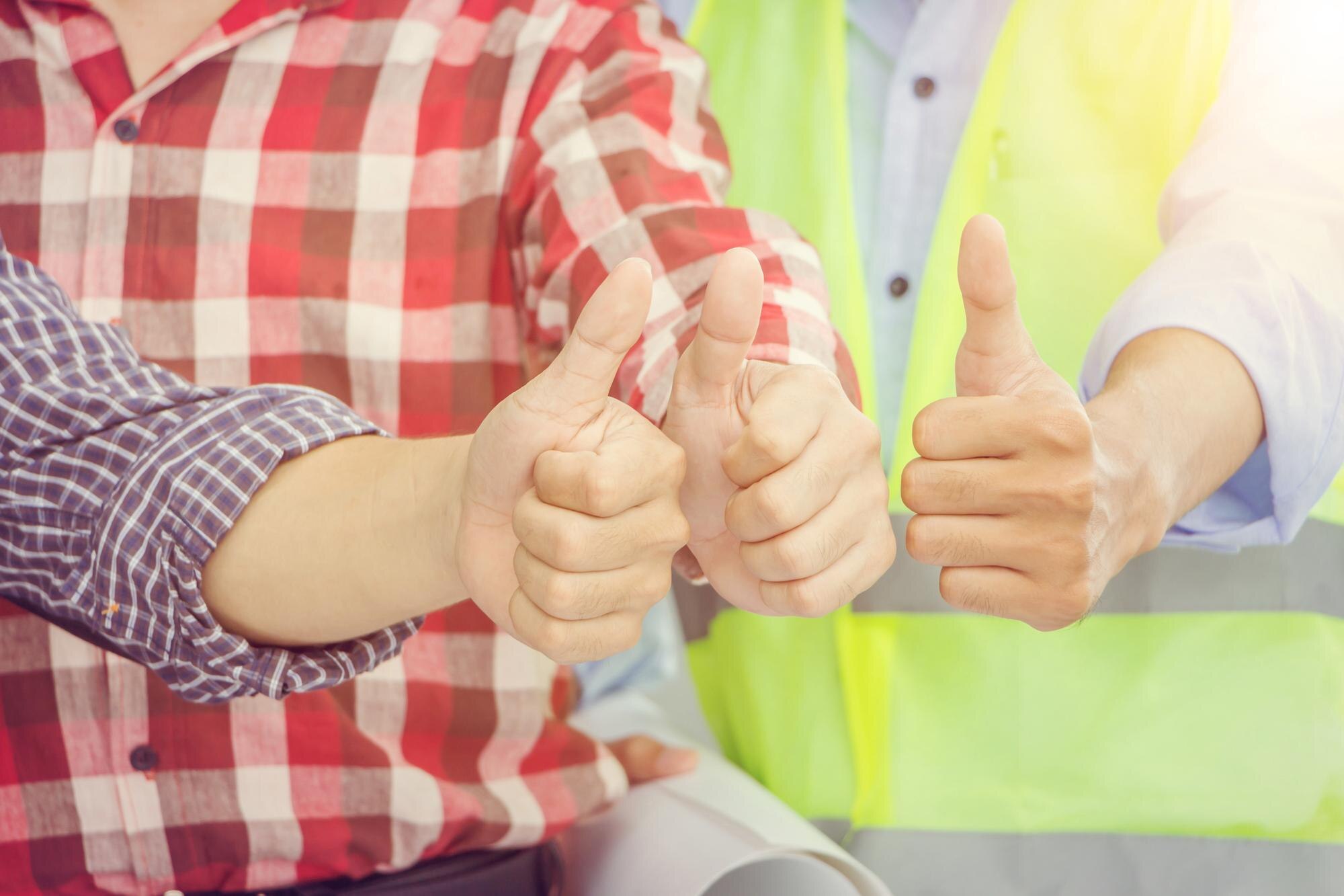 Business engineer man team giving thumb up as sign of Success Business Teamwork Concept
